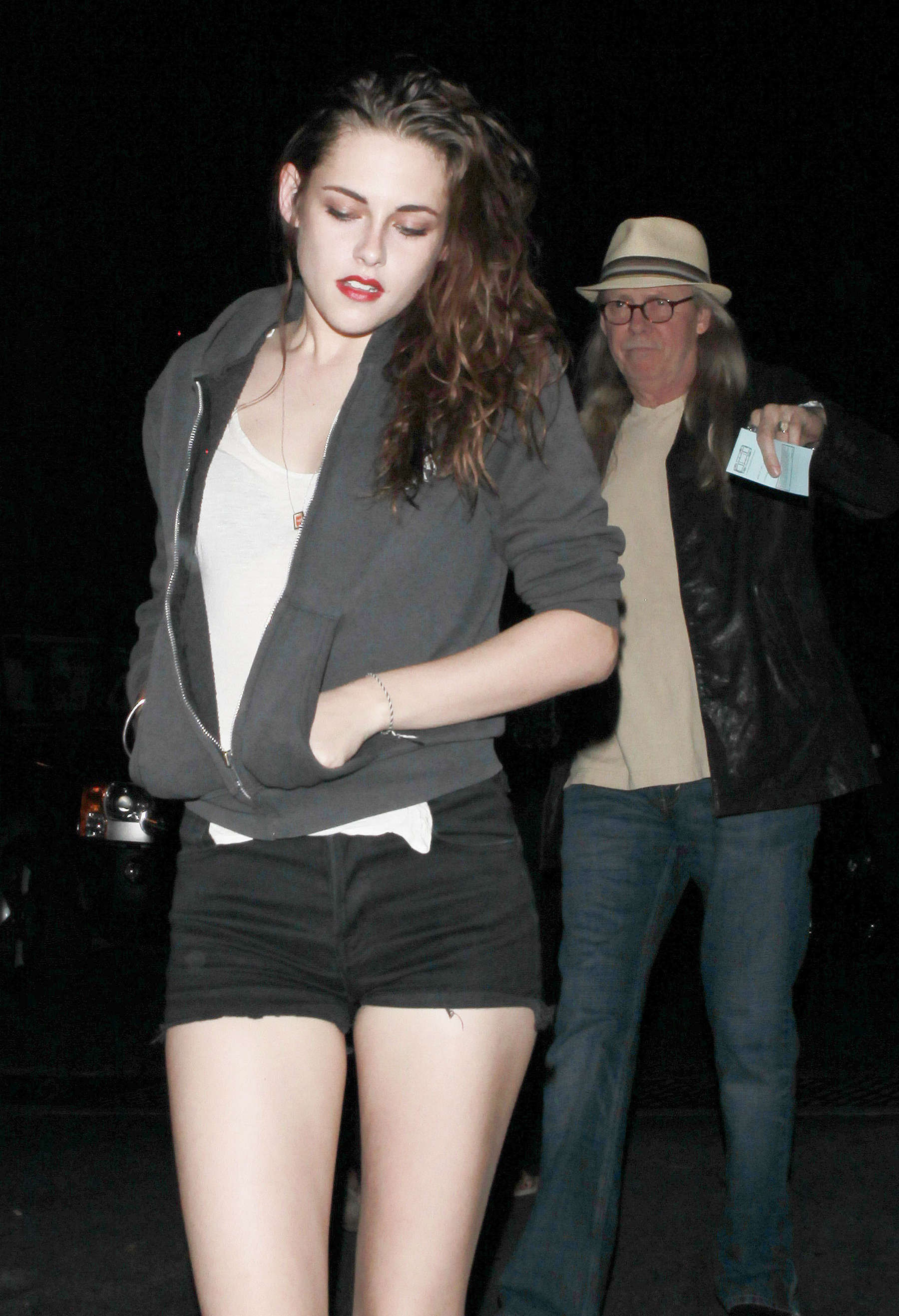 Kristen Stewart showing legs in Short Shorts at Florence and the Machine concert